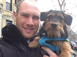 A man holding a dog